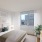 a bedroom with a large window
