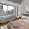 a bedroom with a large window