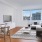 a living room with a tv and couches