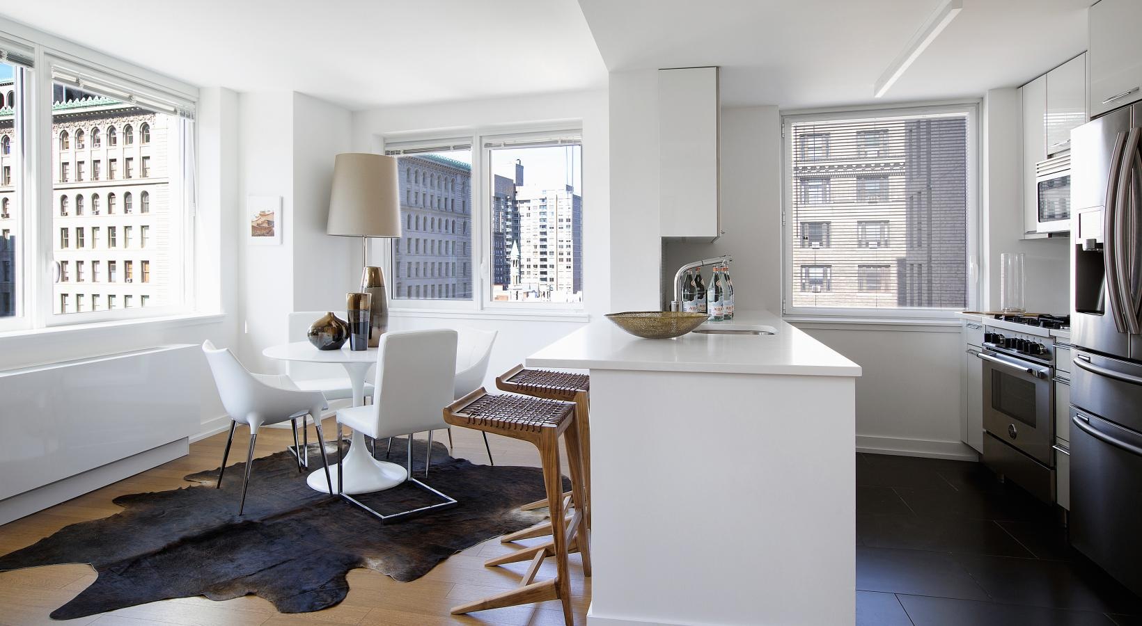 Gorgeous living areas to entertain and enjoy a kitchen with a table and chairs