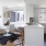 a kitchen with a table and chairs