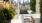 a patio with chairs and tables