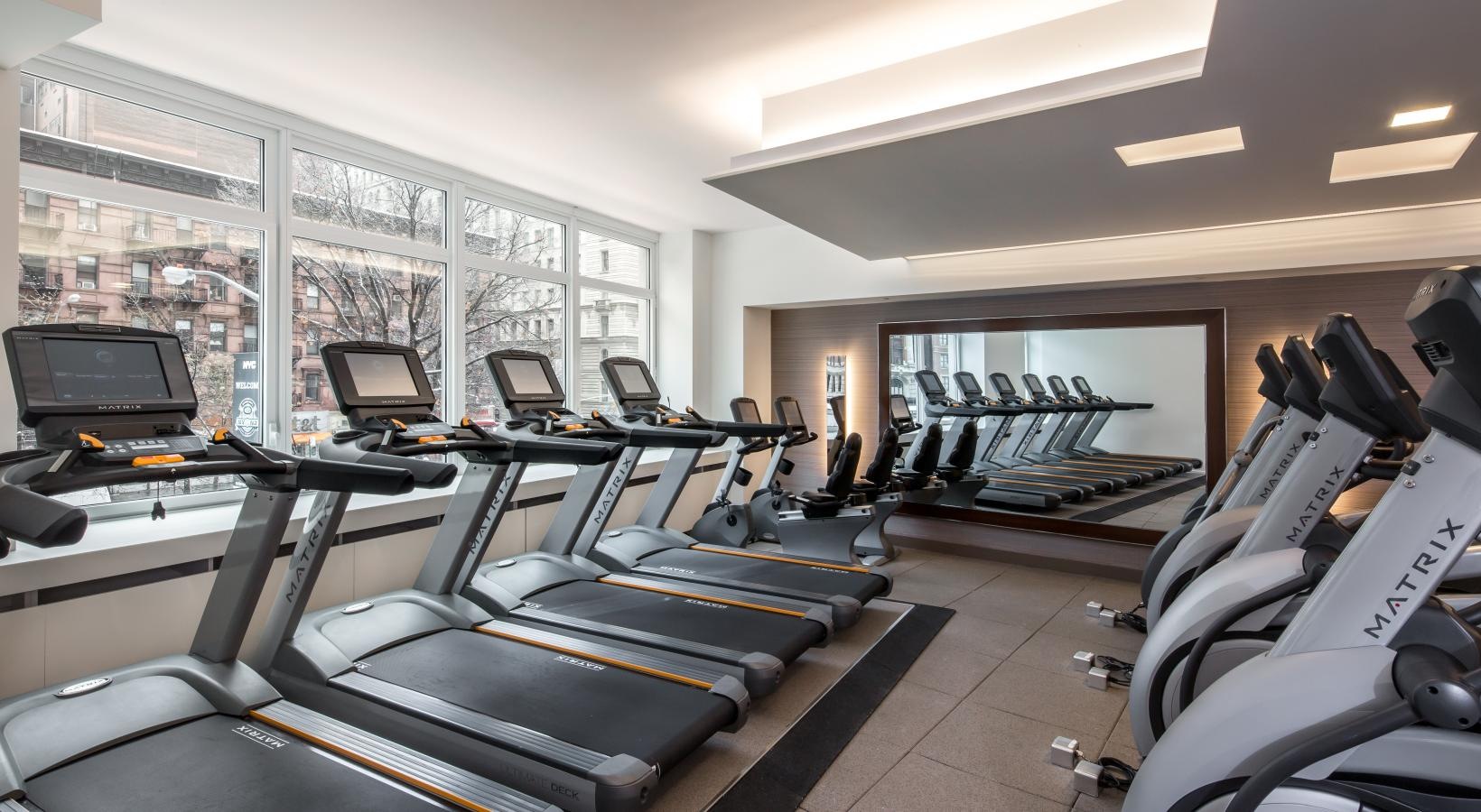 Cutting-edge amenities at your fingertips a room with exercise equipment