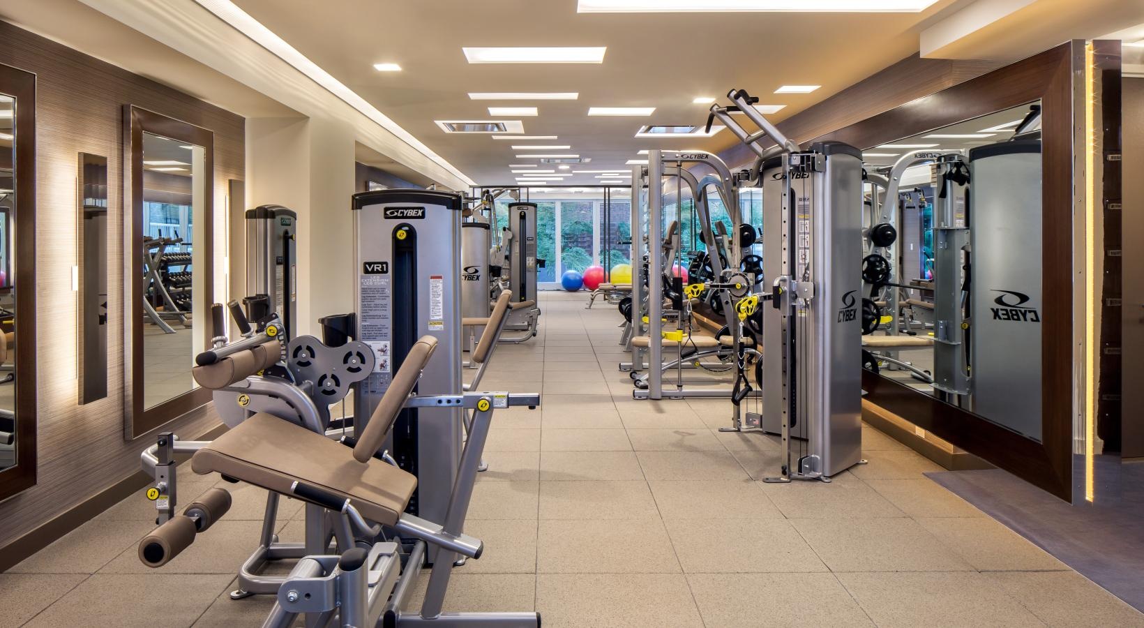 State-of-the-art amenities a gym with exercise equipment