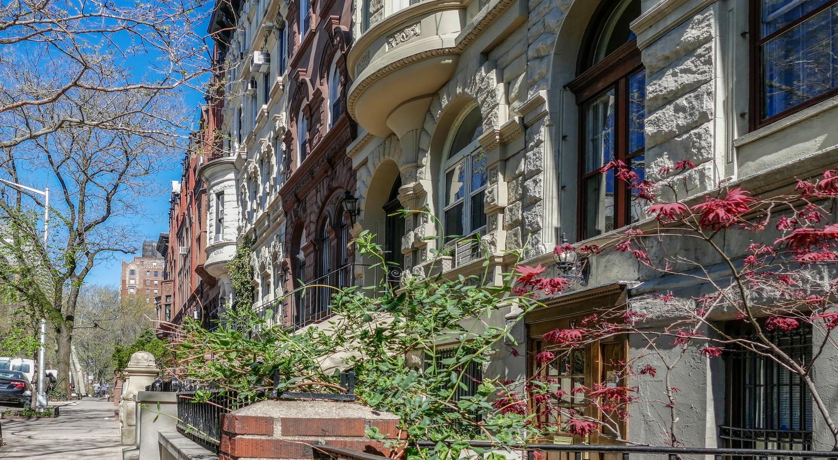 The essence of exceptional living a building with many windows and plants on the side