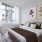 a bedroom with a bed and a table