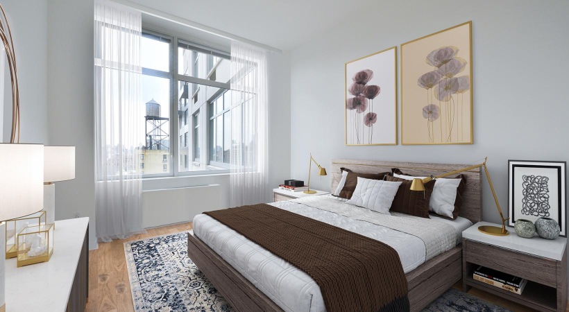 a bedroom with a bed and a table