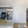 a kitchen with white cabinets