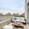 a balcony with a view of a city
