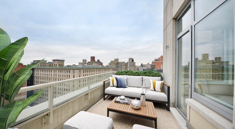 a balcony with a view of a city