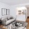 a living room with a tv and couches