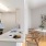 a kitchen with a table and chairs
