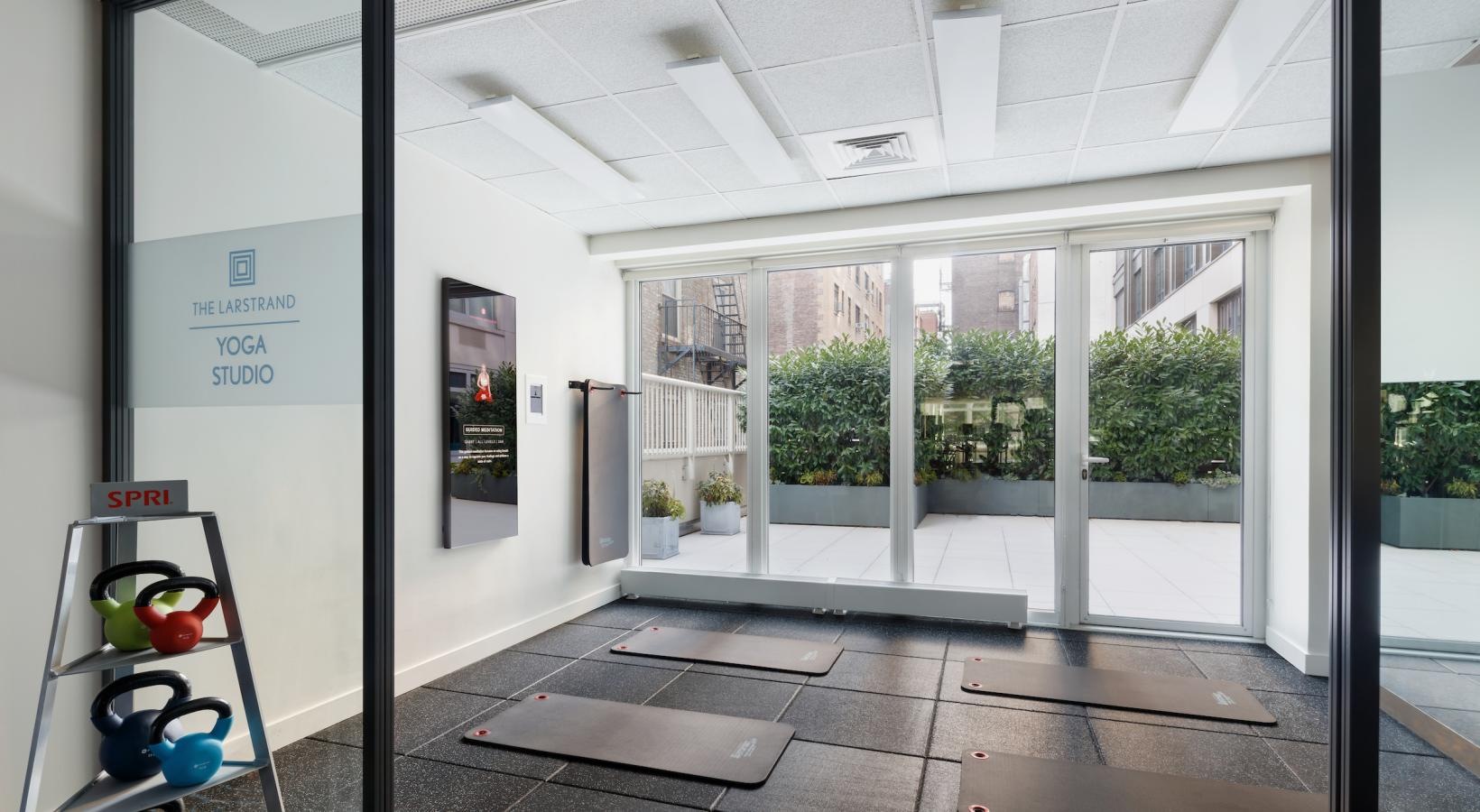 Quick access to state-of-the-art amenities a glass walled building with a sign